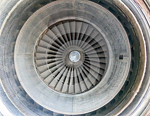 Closeup view looking inside a big jet engine fromÂ a modern airplane